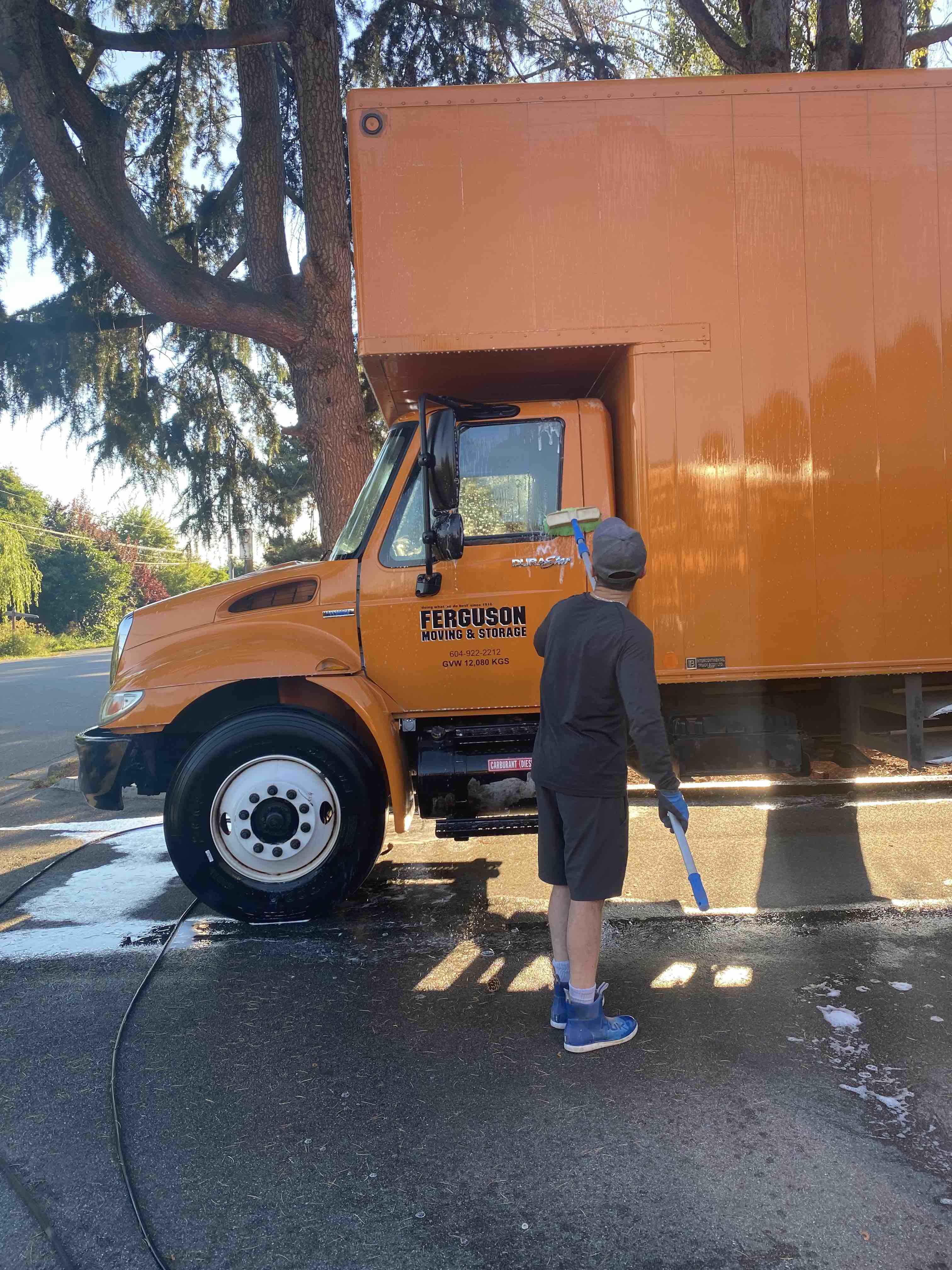employee washing a truck